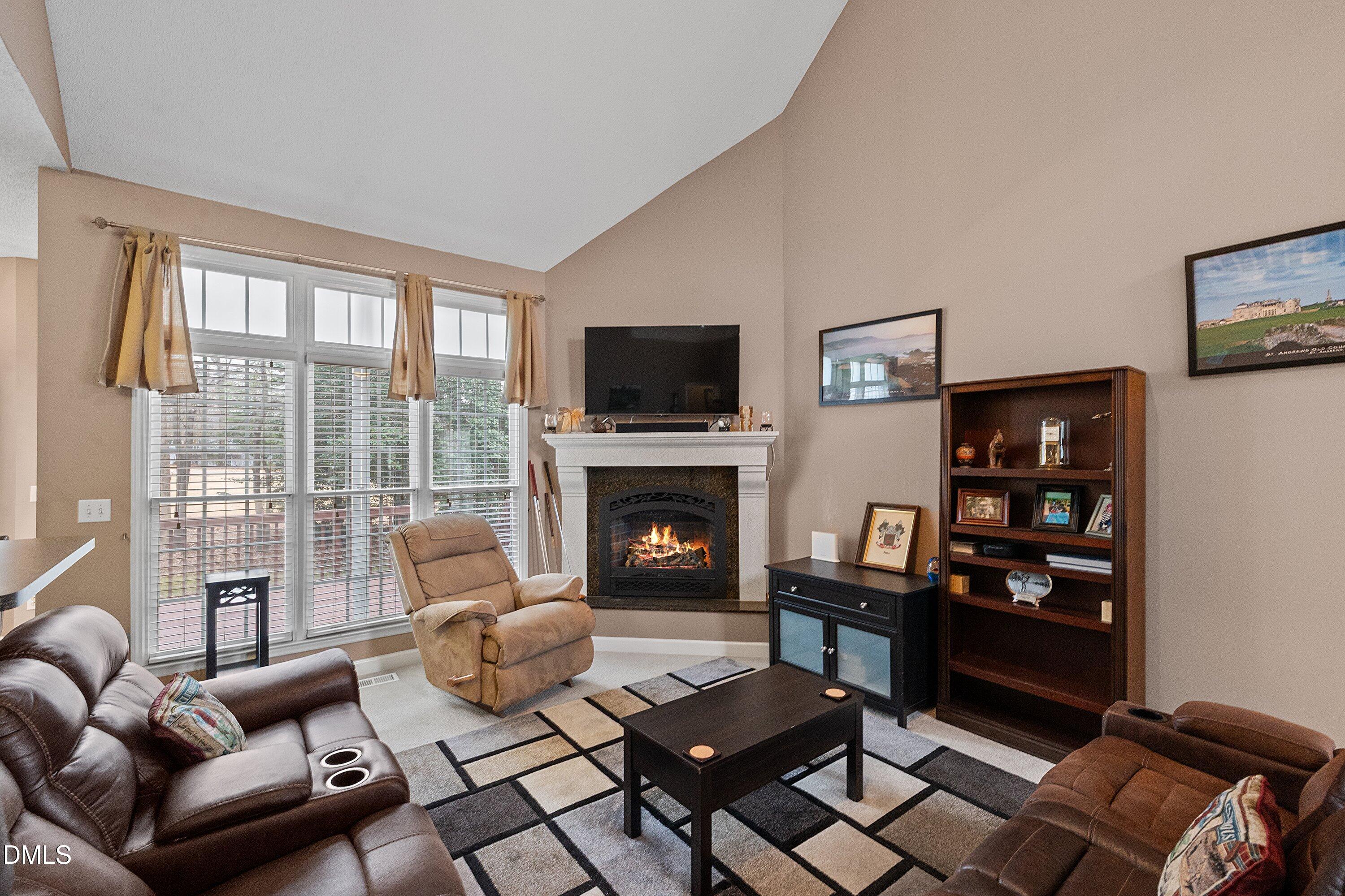 1916 Spanish Bay Court Raleigh, NC 27604 - Photo 11 of 63 a living room with furniture fireplace and flat screen tv