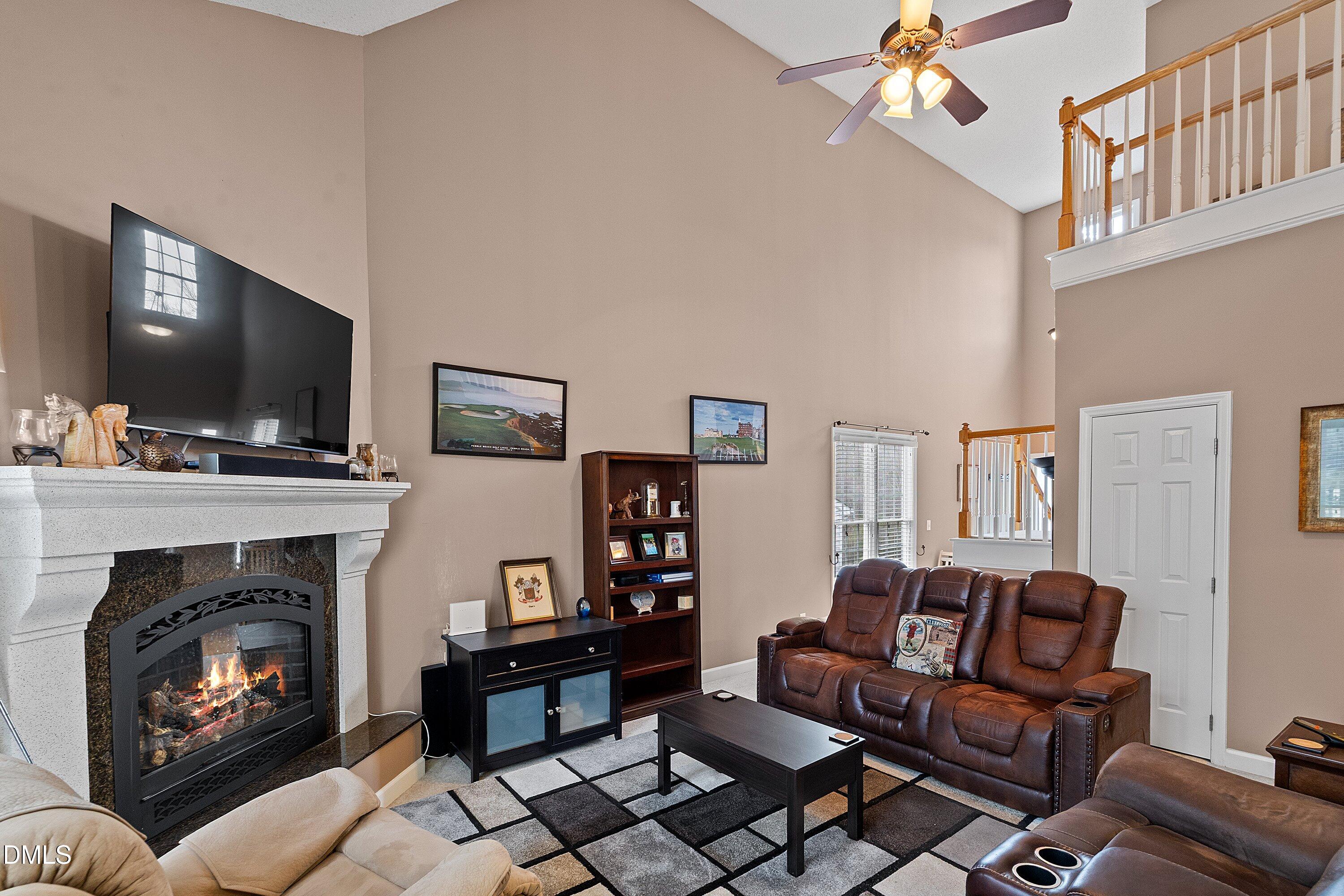 1916 Spanish Bay Court Raleigh, NC 27604 - Photo 12 of 63 a living room with furniture and a fireplace