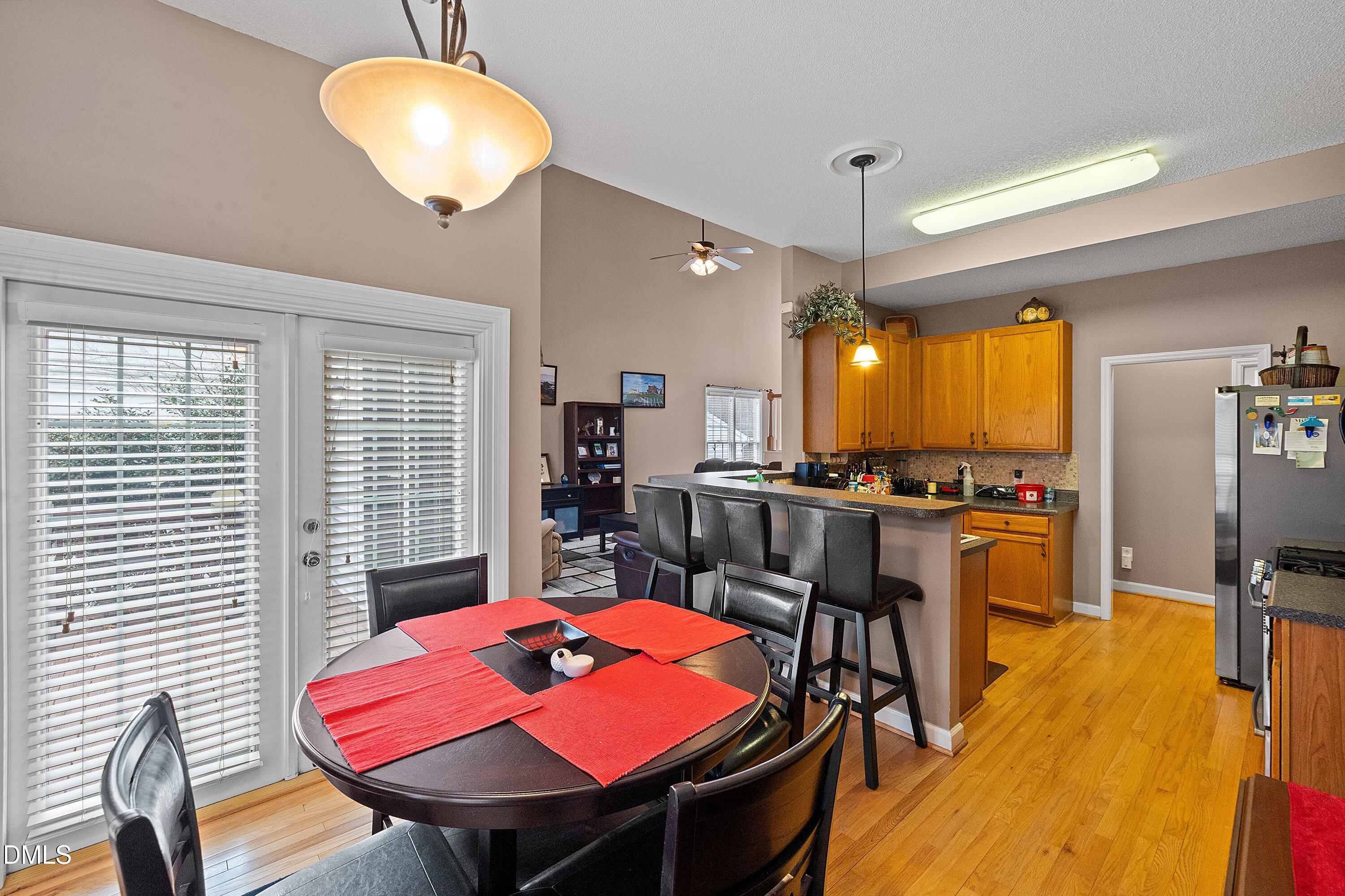 1916 Spanish Bay Court Raleigh, NC 27604 - Photo 17 of 63 a view of a dining room with furniture and a chandelier