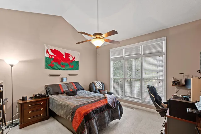a bathroom with a double vanity sink a mirror and a shower