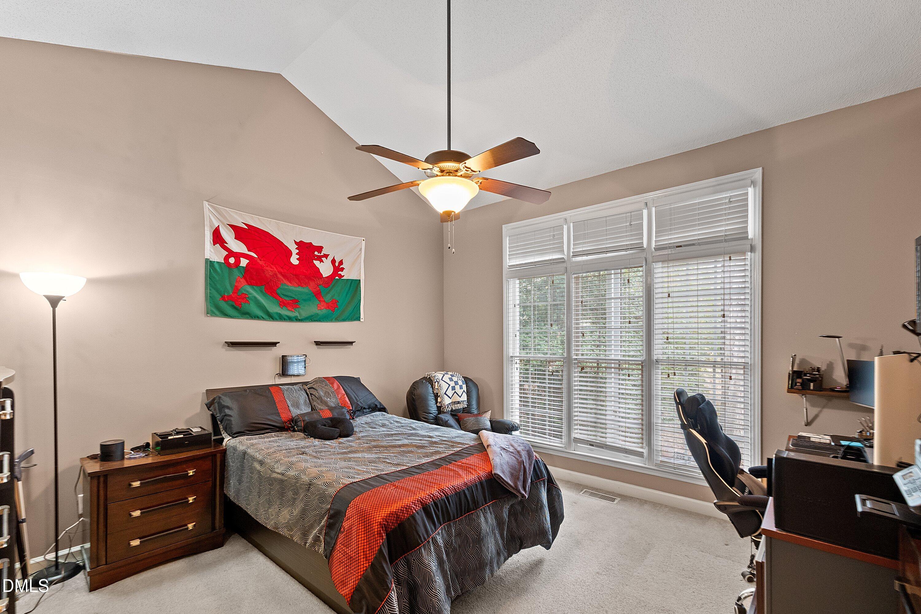 1916 Spanish Bay Court Raleigh, NC 27604 - Photo 20 of 63 a bedroom with a bed and a flat screen tv