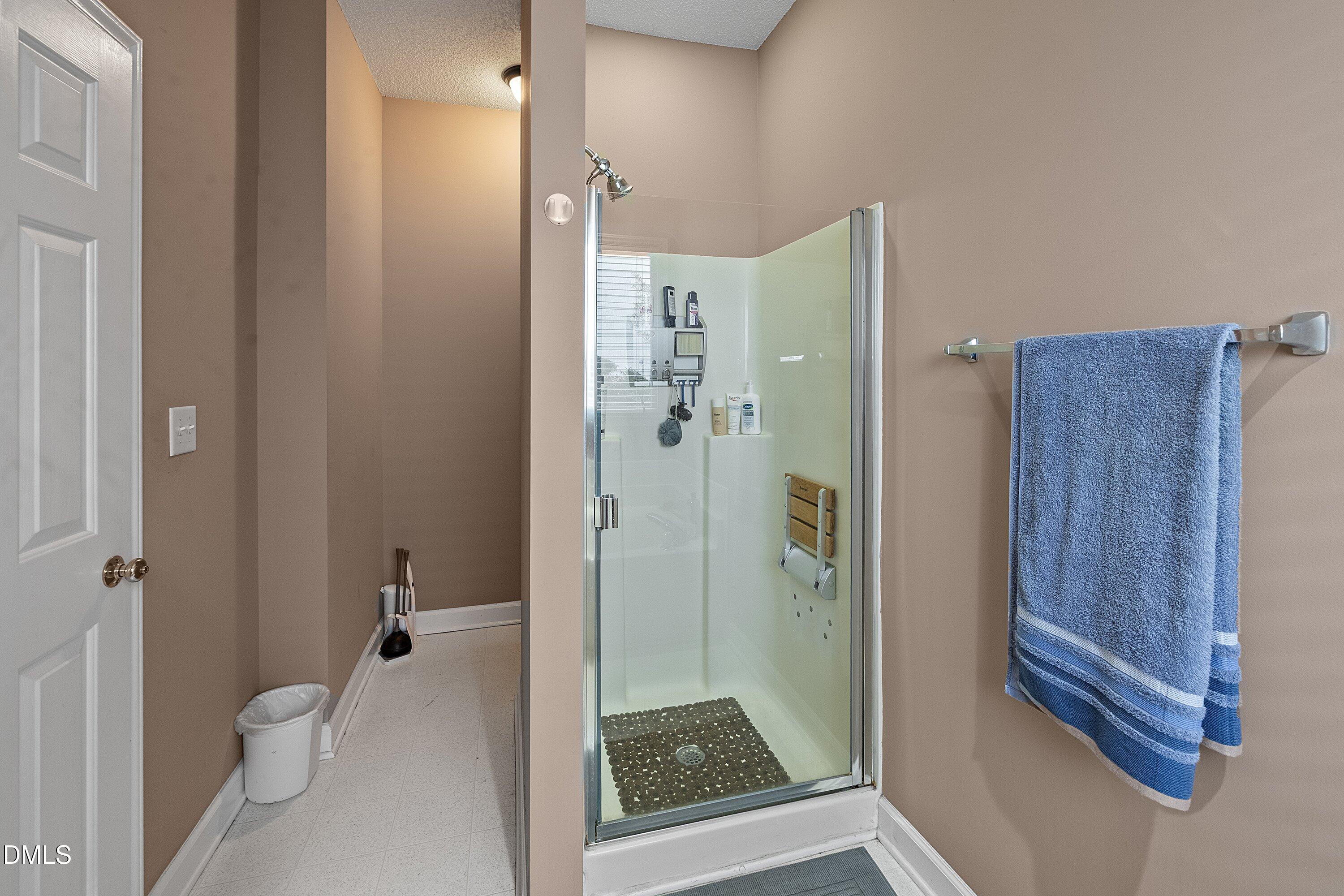 1916 Spanish Bay Court Raleigh, NC 27604 - Photo 24 of 63 a bathroom with a shower and a toilet