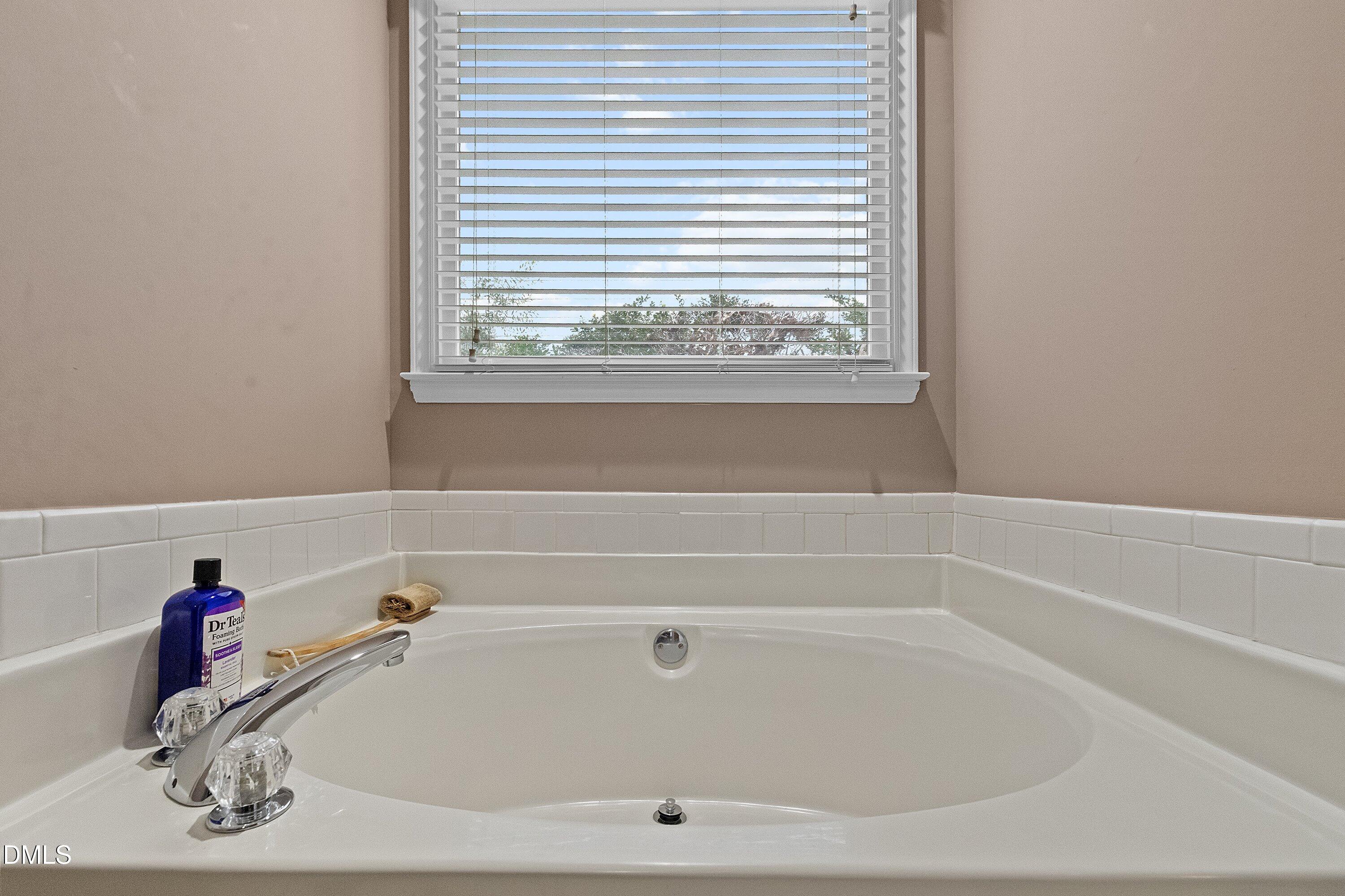 1916 Spanish Bay Court Raleigh, NC 27604 - Photo 25 of 63 a bathroom with a bathtub