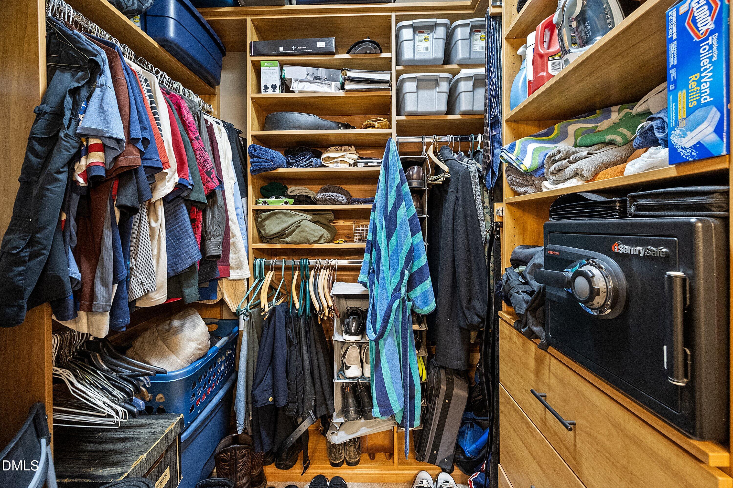 1916 Spanish Bay Court Raleigh, NC 27604 - Photo 26 of 63 a view of walk in closet with clothes and shoes
