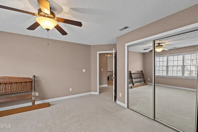 a view of a tree in the middle of a yard