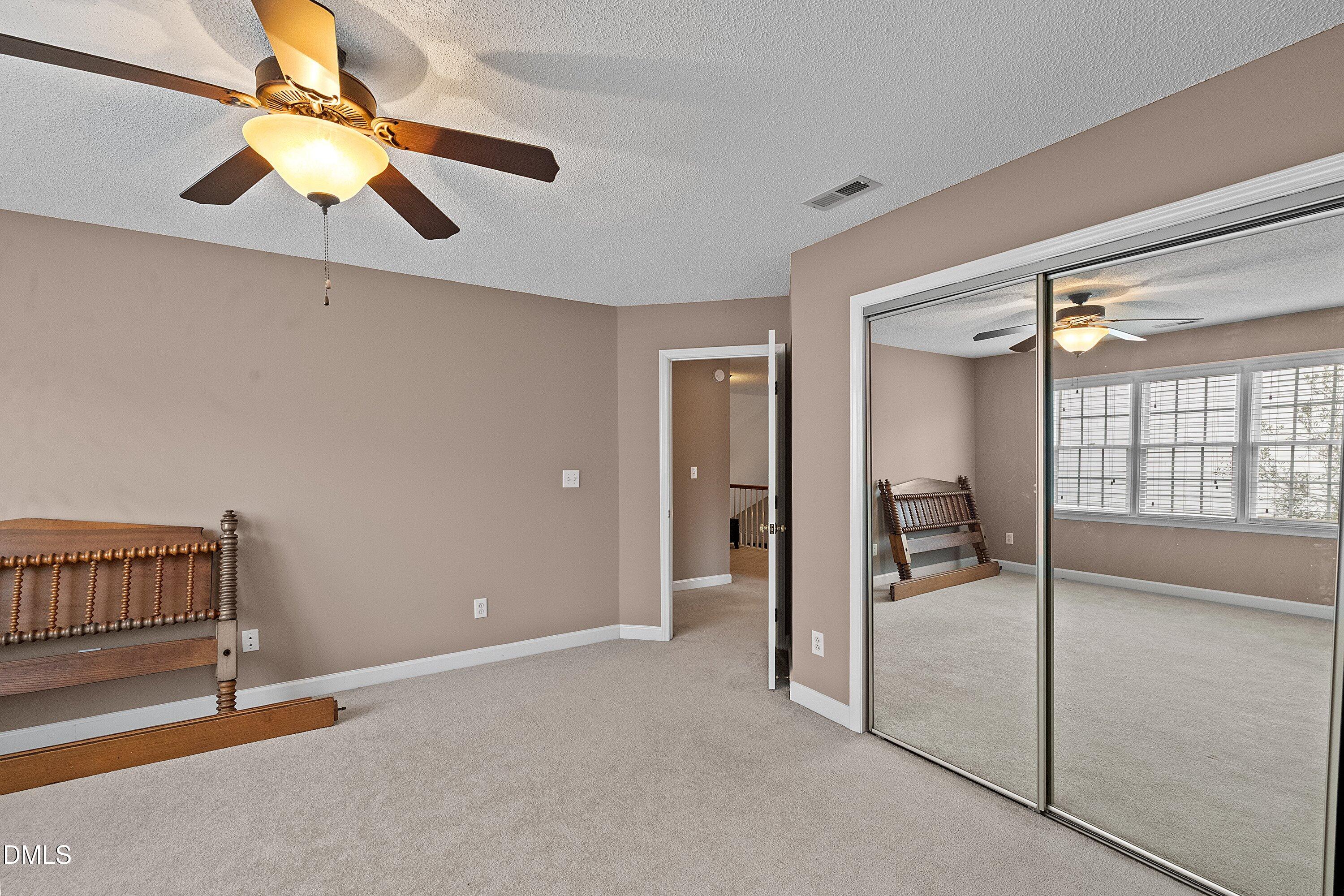 1916 Spanish Bay Court Raleigh, NC 27604 - Photo 35 of 63 a view of a hallway with a chandelier