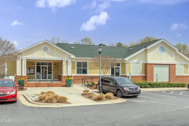 a view of a yard with a large tree