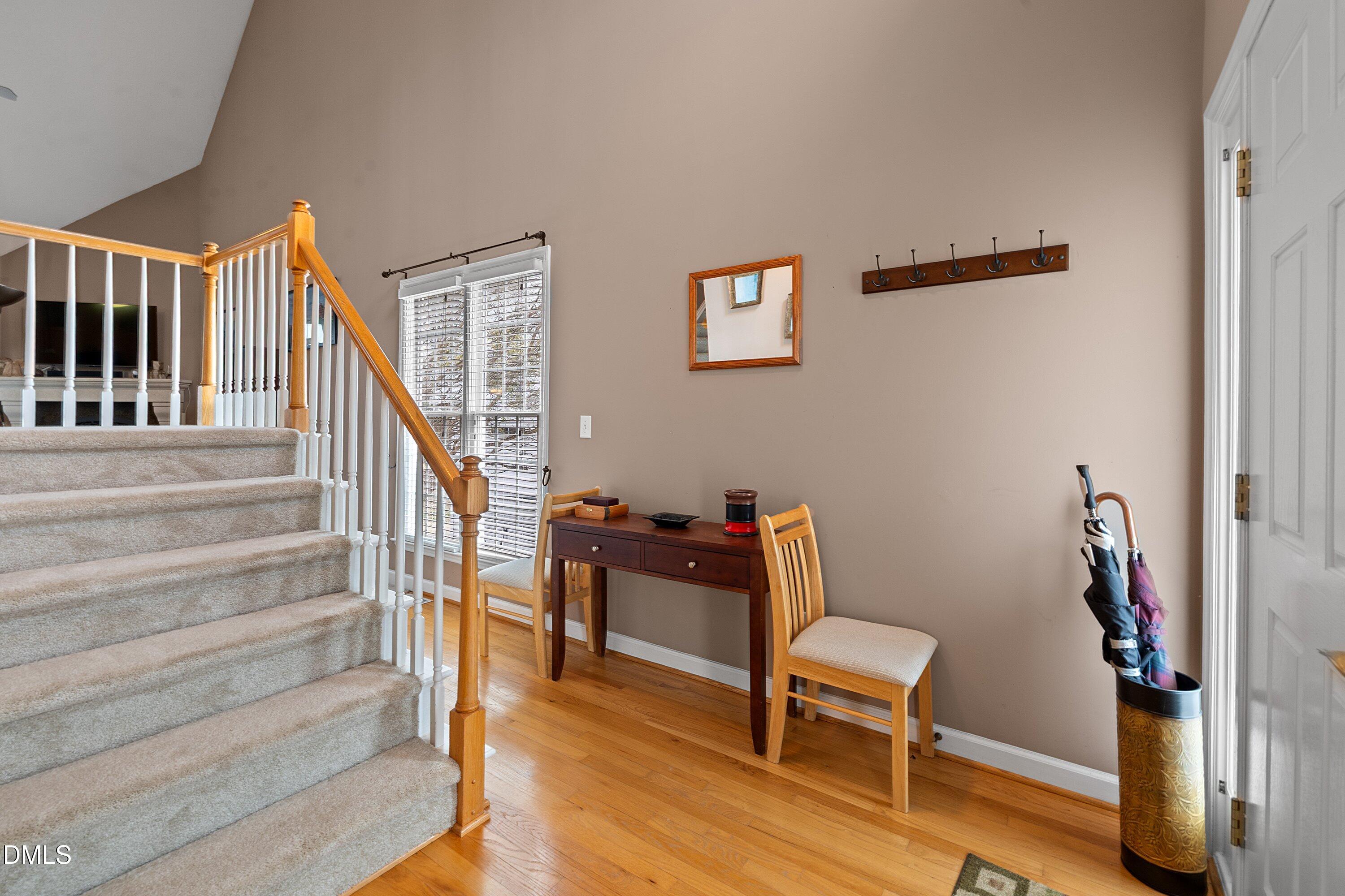 1916 Spanish Bay Court Raleigh, NC 27604 - Photo 7 of 63 a living room with furniture and a wooden floor