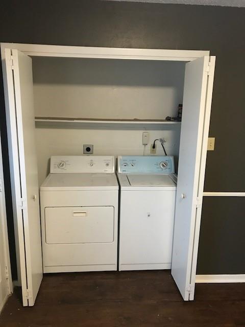4023 William Street Sachse, TX 75048 - Photo 25 of 36 Laundry area with dark wood-type flooring and separate washer and dryer