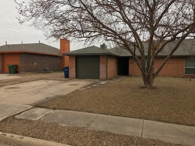 4023 William Street Sachse, TX 75048 - Photo 26 of 36 View of front of home with a chimney, brick siding, a garage, and concrete driveway