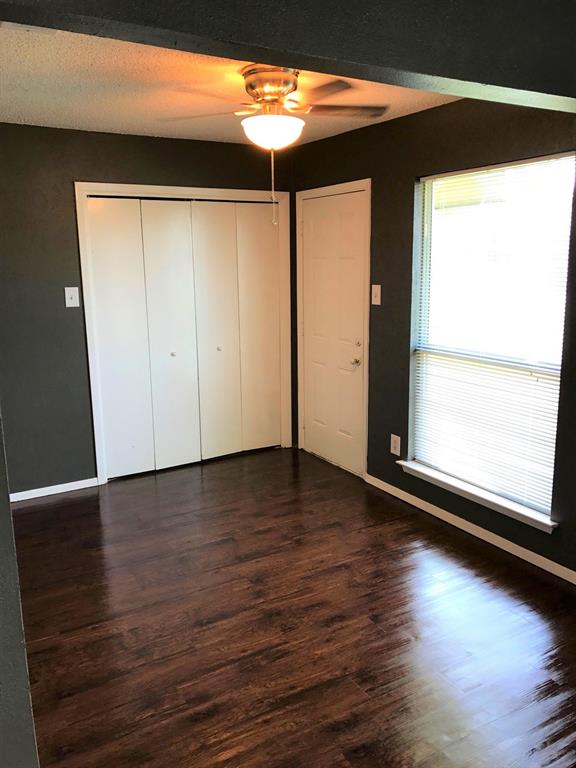 4023 William Street Sachse, TX 75048 - Photo 6 of 36 4023 bedroom with wood style floors, a closet, and a ceiling fan
