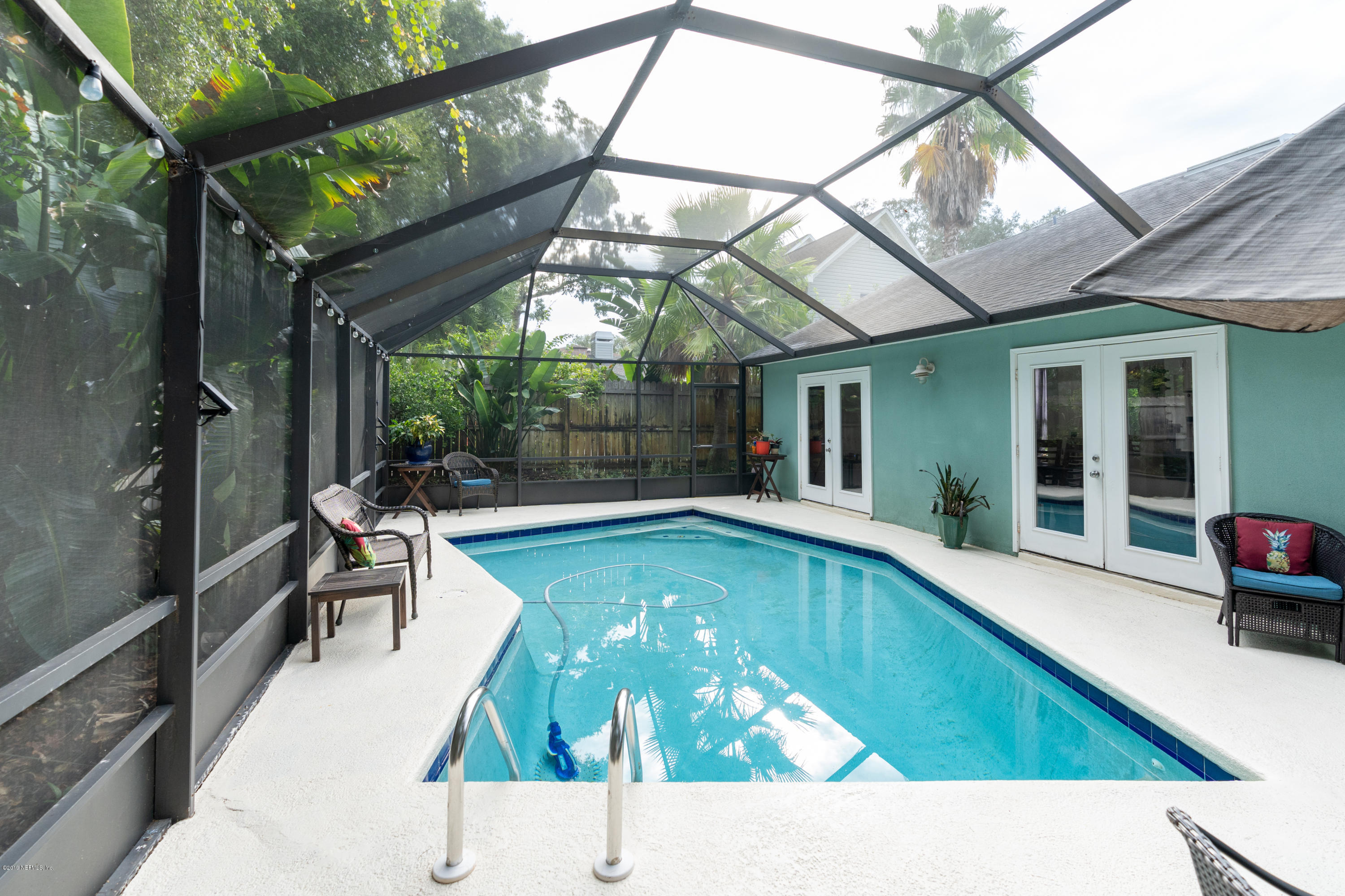9 Beach Street St. Augustine, FL 32080 - Photo 17 of 28 a swimming pool with patio outdoor seating and yard
