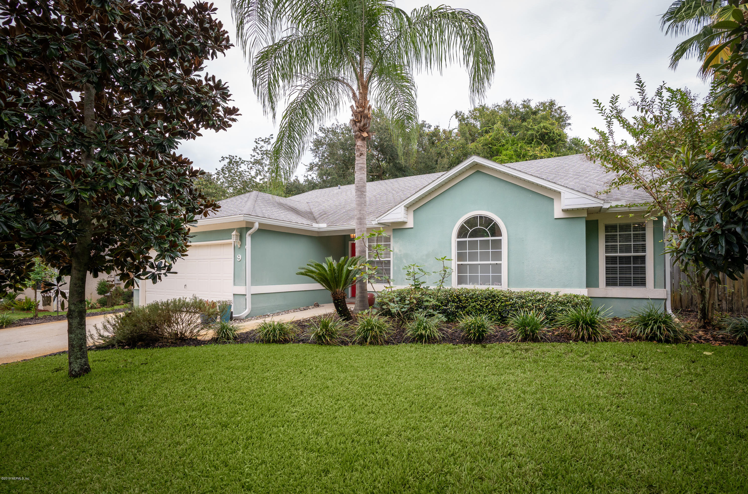 9 Beach Street St. Augustine, FL 32080 - Photo 2 of 28 a front view of house with yard and green space