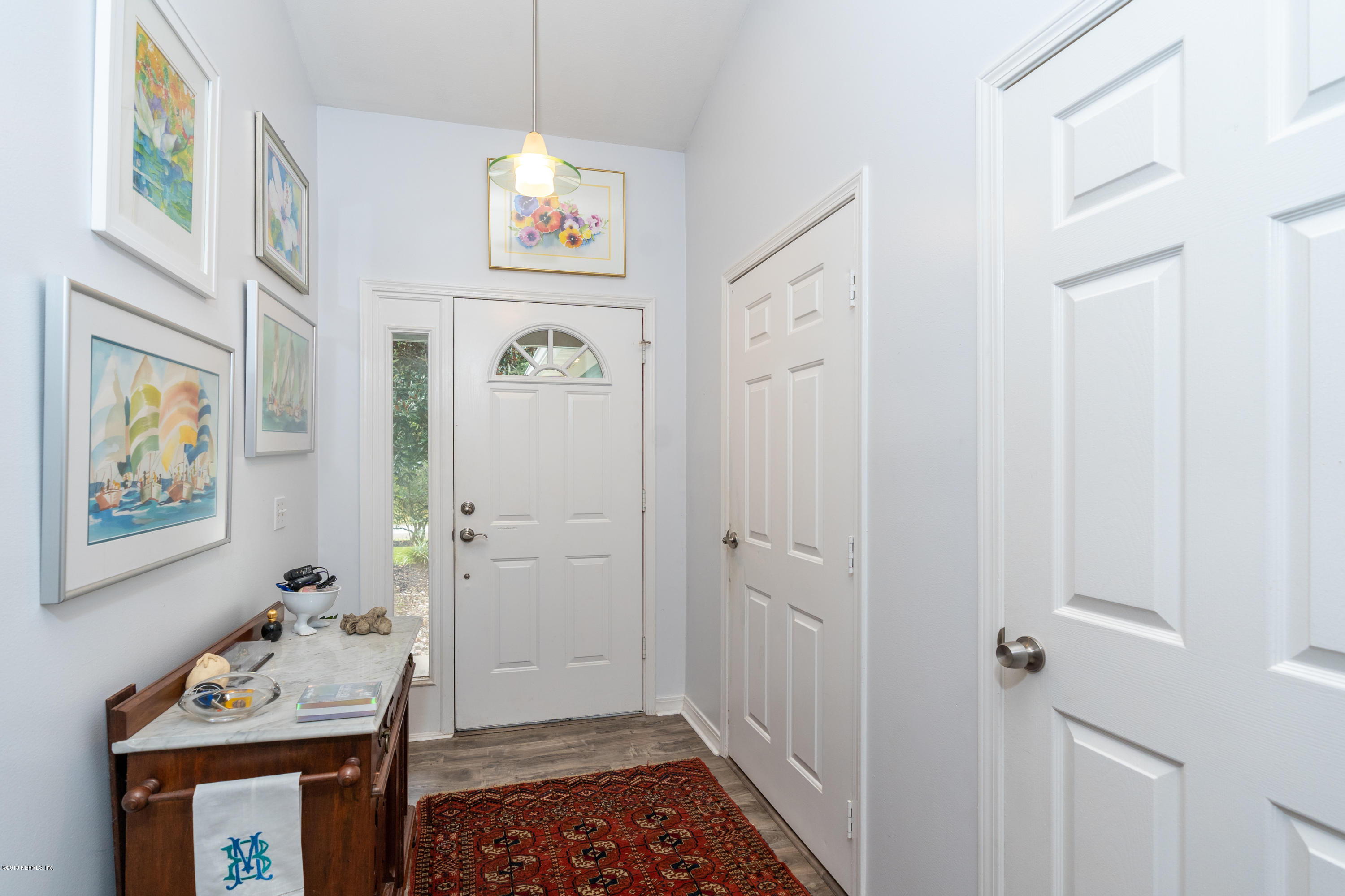 9 Beach Street St. Augustine, FL 32080 - Photo 5 of 28 a view of an entryway with wooden floor
