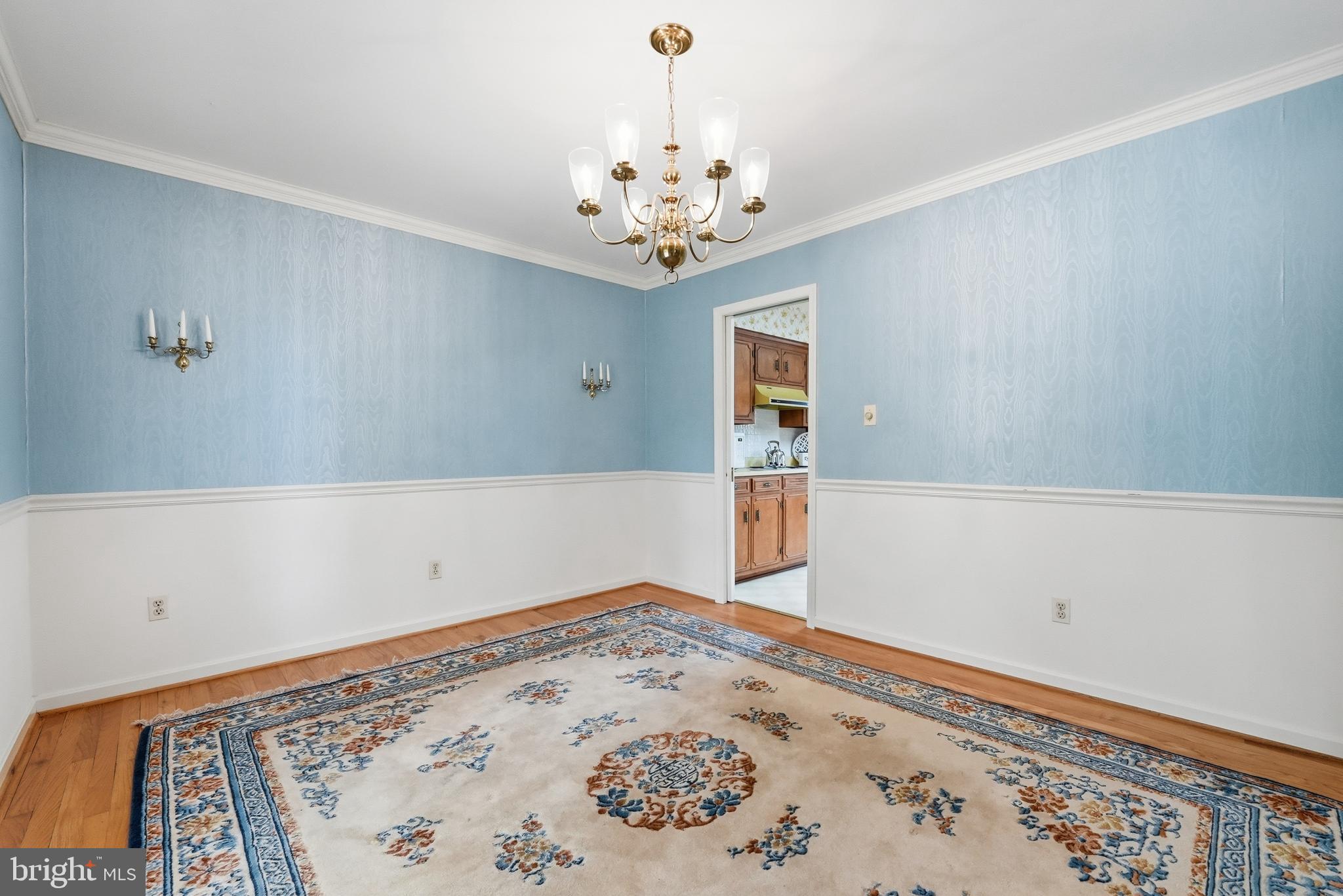 11081 Marquis Road Unionville, VA 22567 - Photo 17 of 49 a view of a chandelier fan and wooden floor