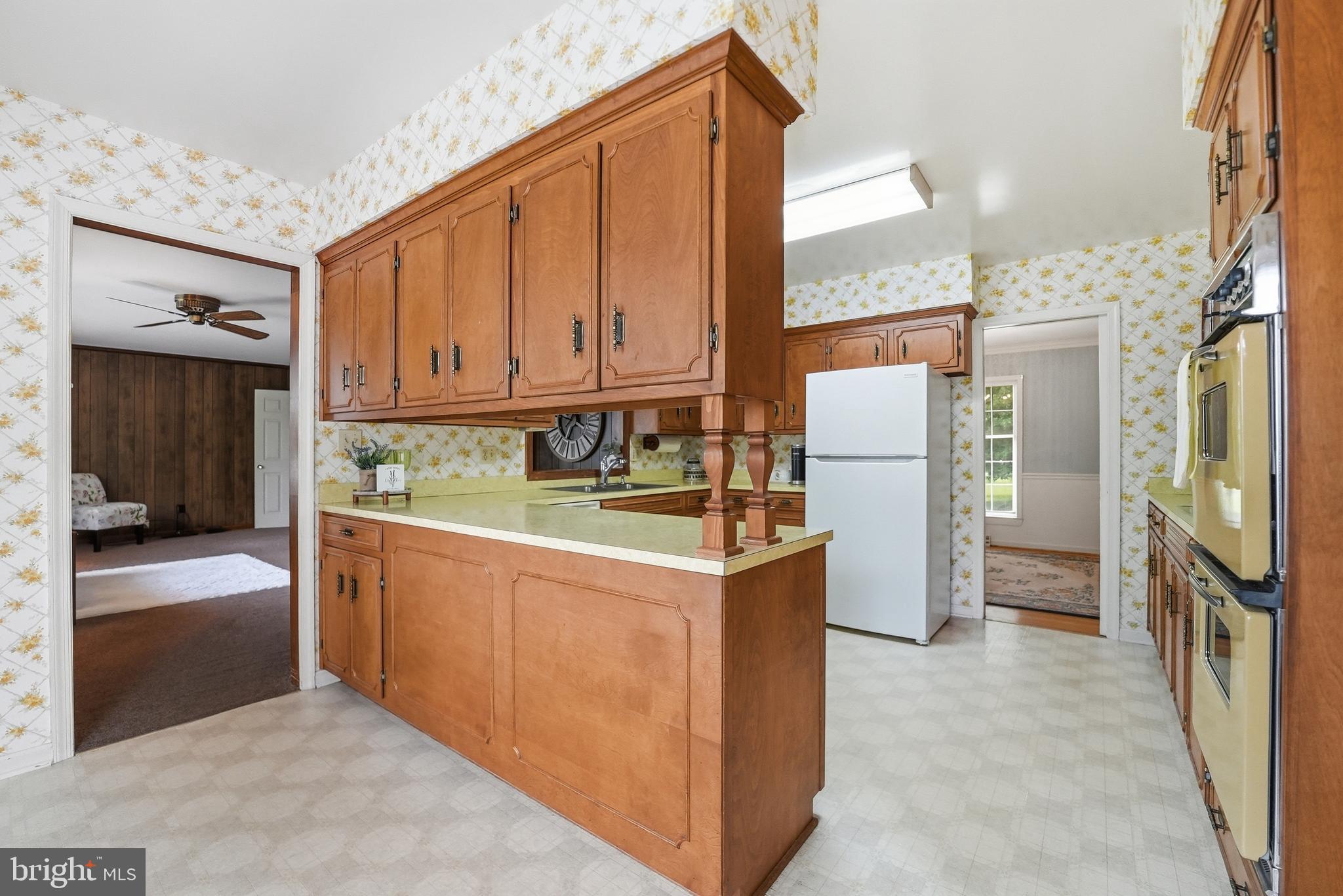 11081 Marquis Road Unionville, VA 22567 - Photo 21 of 49 a kitchen with refrigerator cabinets and a sink