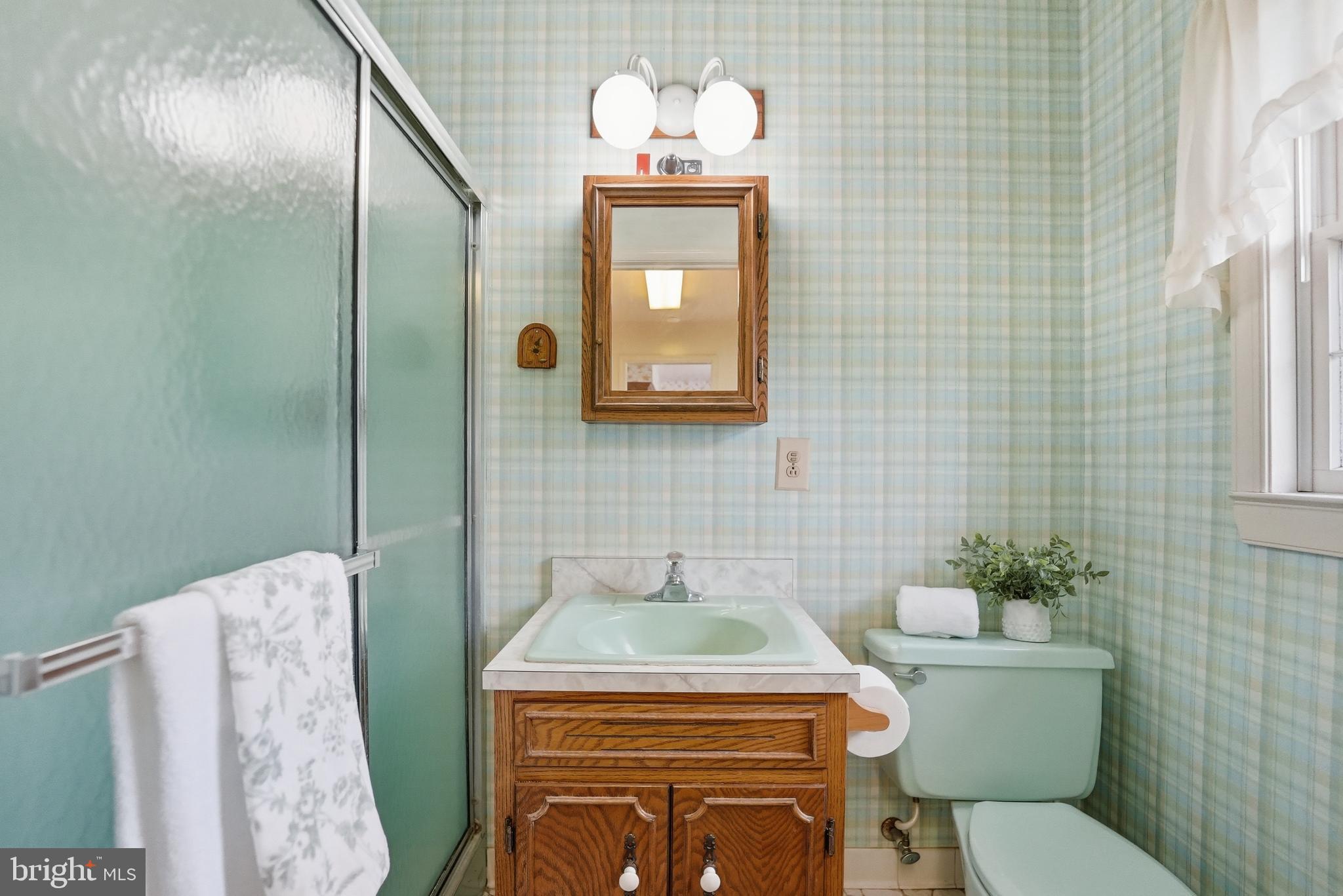 11081 Marquis Road Unionville, VA 22567 - Photo 27 of 49 a bathroom with a toilet sink and mirror