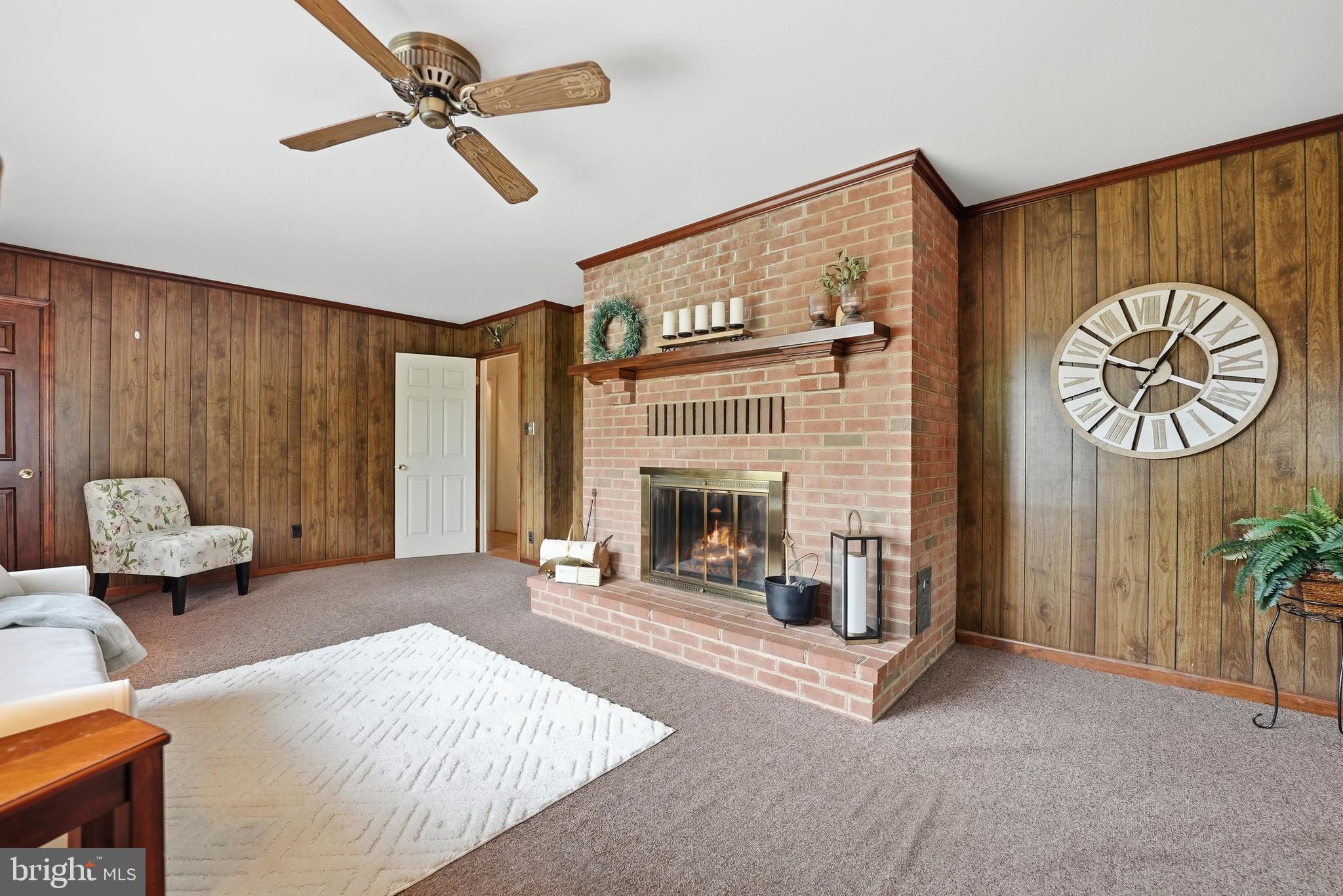 11081 Marquis Road Unionville, VA 22567 - Photo 30 of 49 a living room with furniture and a fireplace