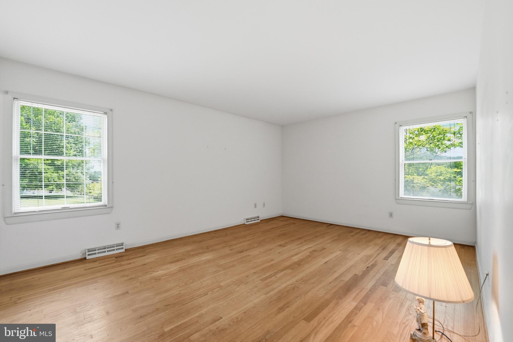 11081 Marquis Road Unionville, VA 22567 - Photo 36 of 49 an empty room with wooden floor and windows