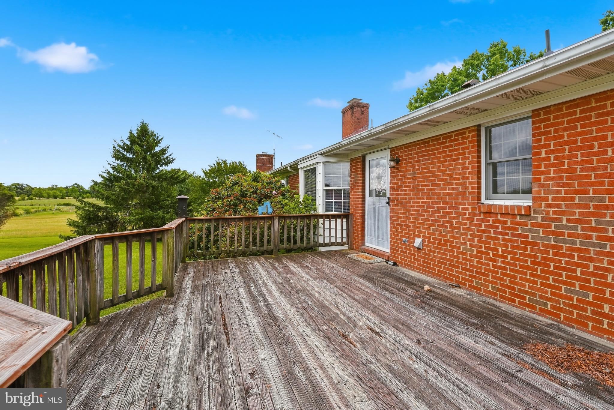 11081 Marquis Road Unionville, VA 22567 - Photo 38 of 49 a view of deck with wooden floor and fence with a large garden