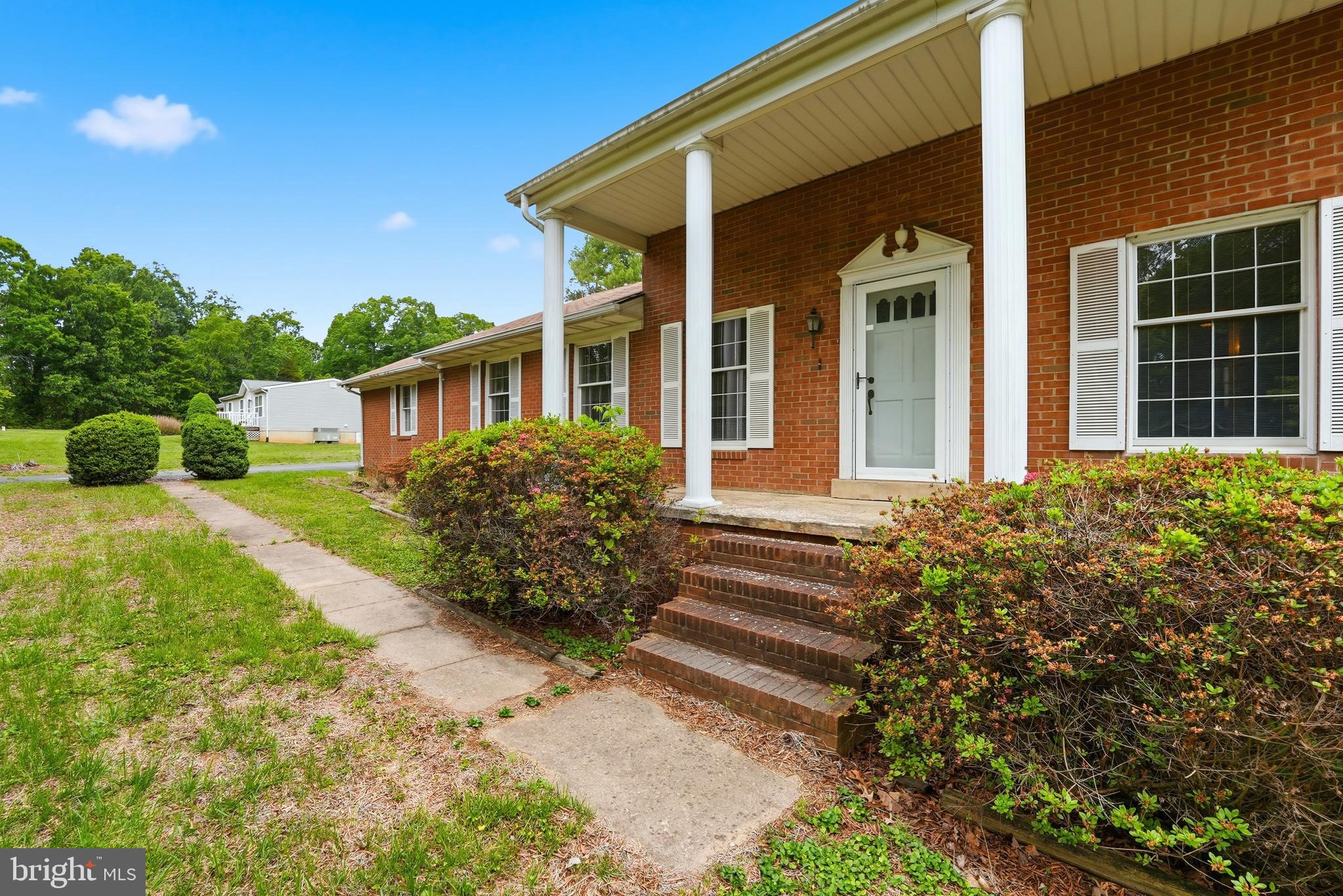 11081 Marquis Road Unionville, VA 22567 - Photo 6 of 49 a front view of a house with garden