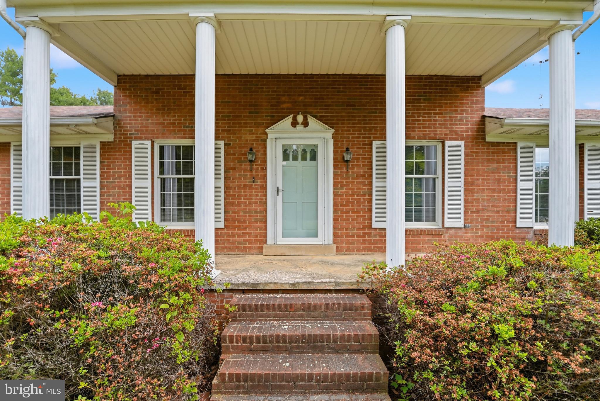 11081 Marquis Road Unionville, VA 22567 - Photo 8 of 49 a front view of a house with a garden