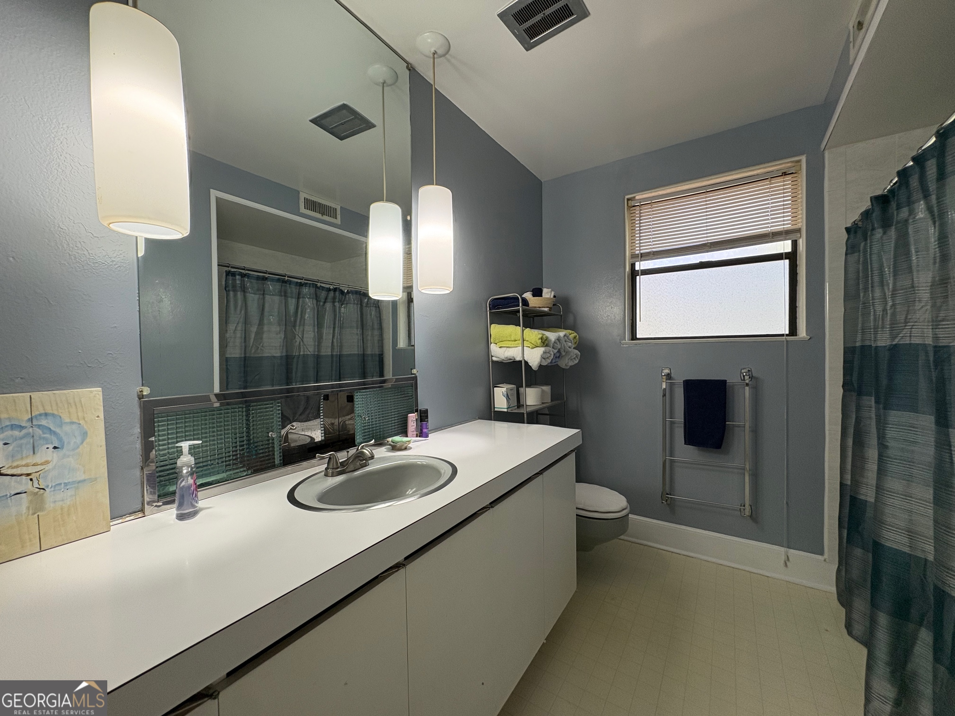 700 Forrest Drive Fort Valley, GA 31030 - Photo 26 of 41 a bathroom with a sink double vanity and a mirror