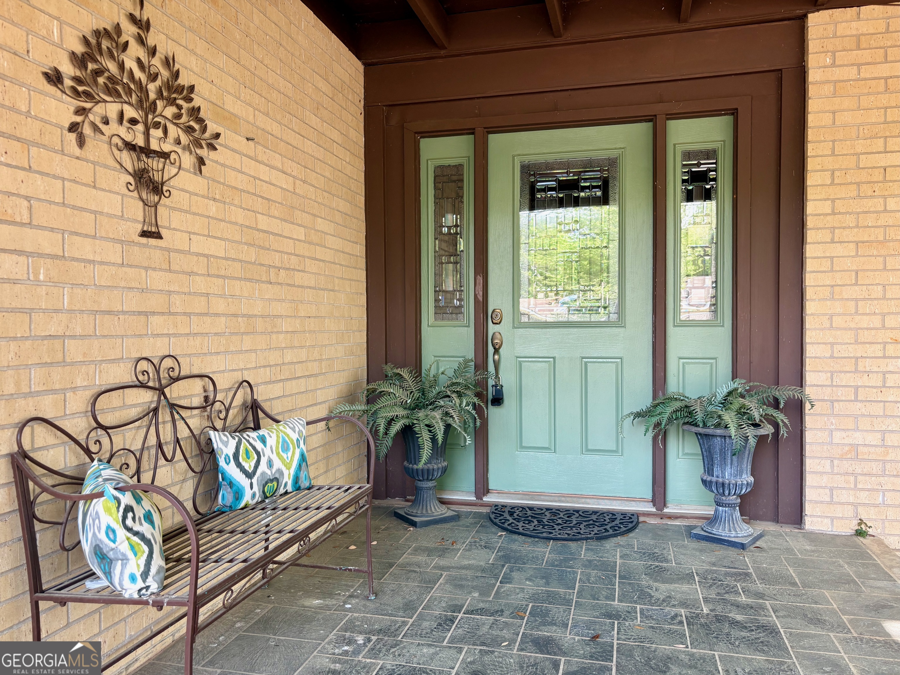 700 Forrest Drive Fort Valley, GA 31030 - Photo 5 of 41 a potted plant in front of a door