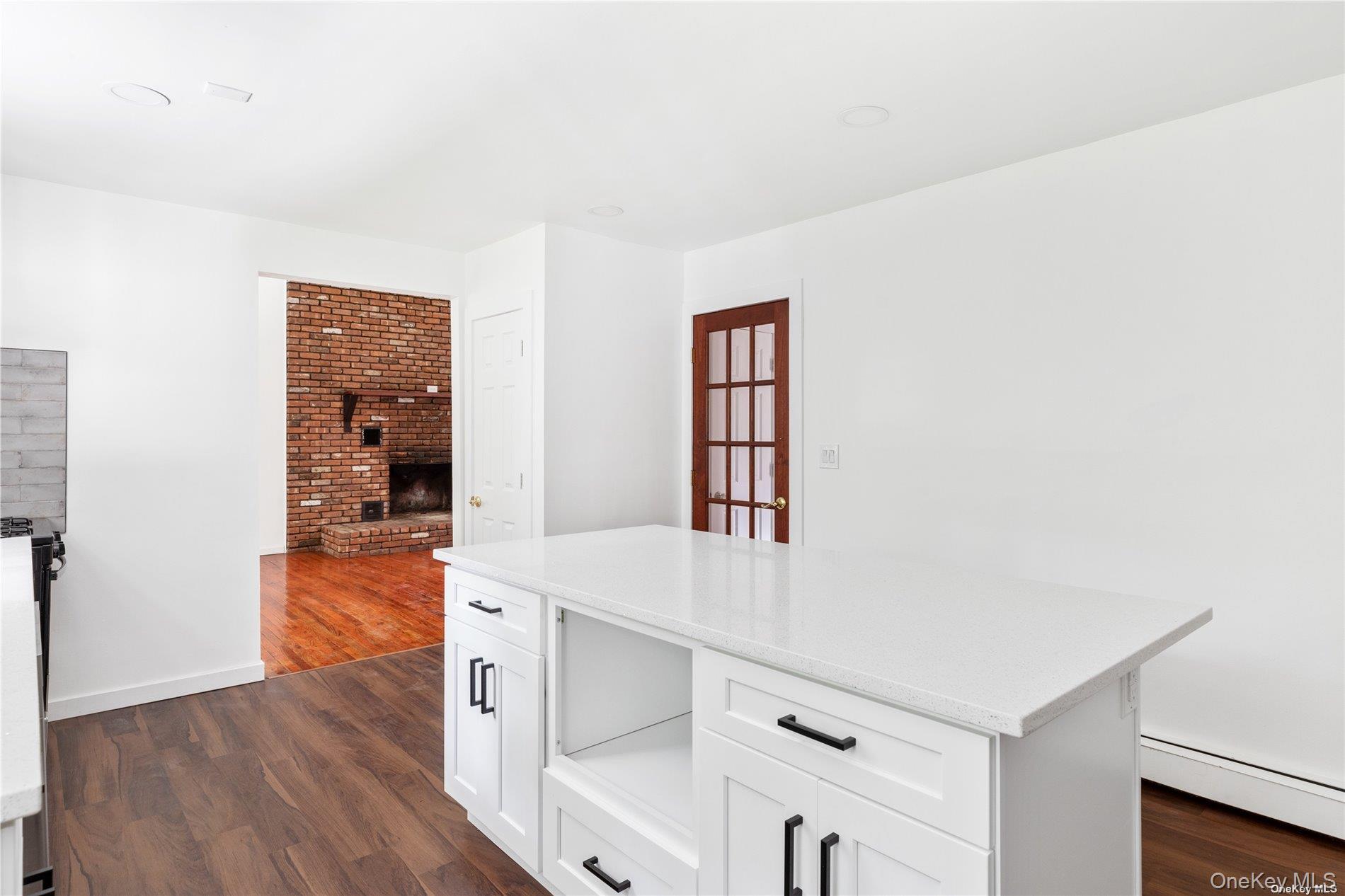 110 East Bartlett Road Middle Island, NY 11953 - Photo 11 of 29 an entryway with wooden floor and cabinet