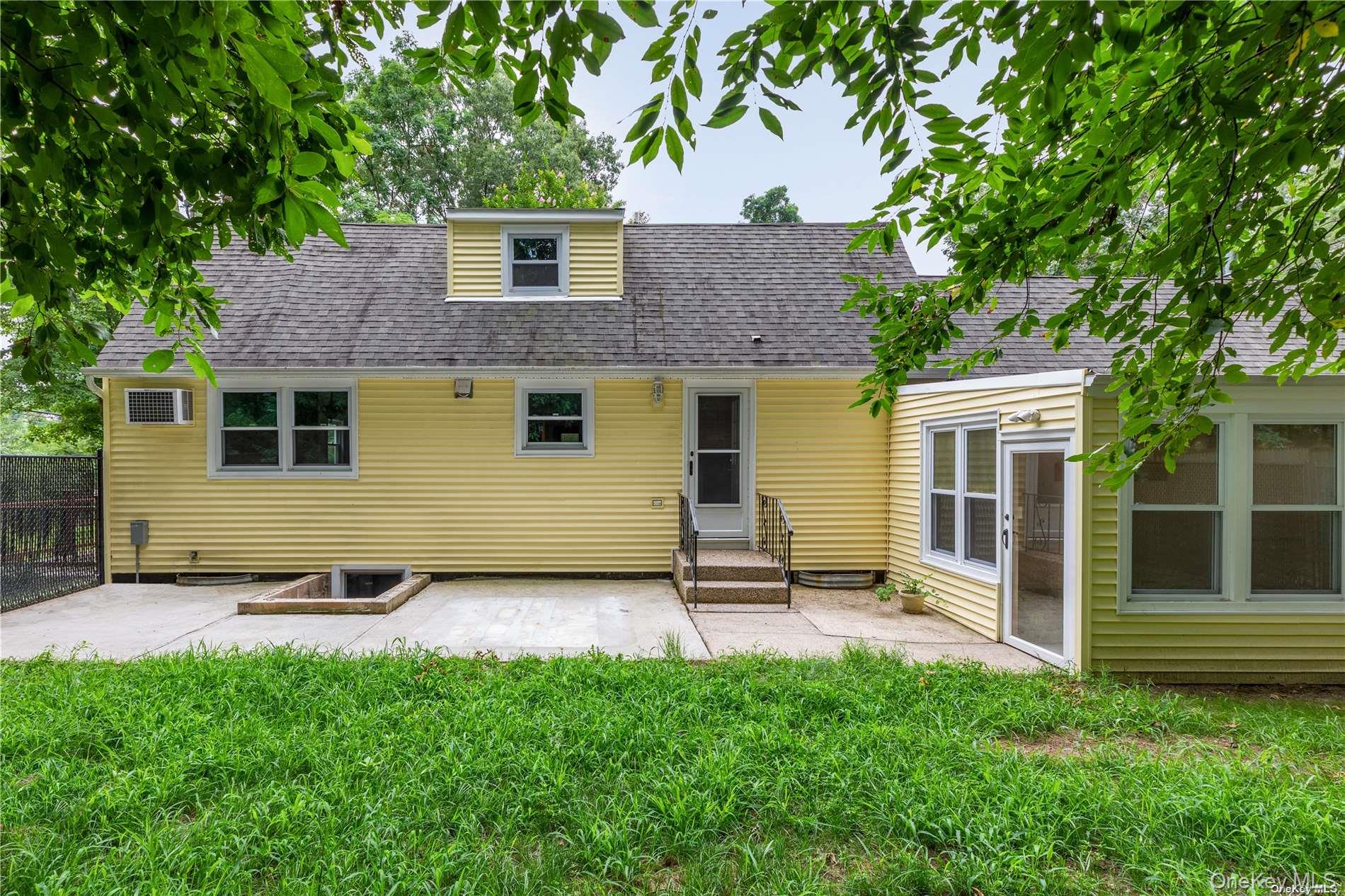 110 East Bartlett Road Middle Island, NY 11953 - Photo 26 of 29 a view of front of a house with a yard