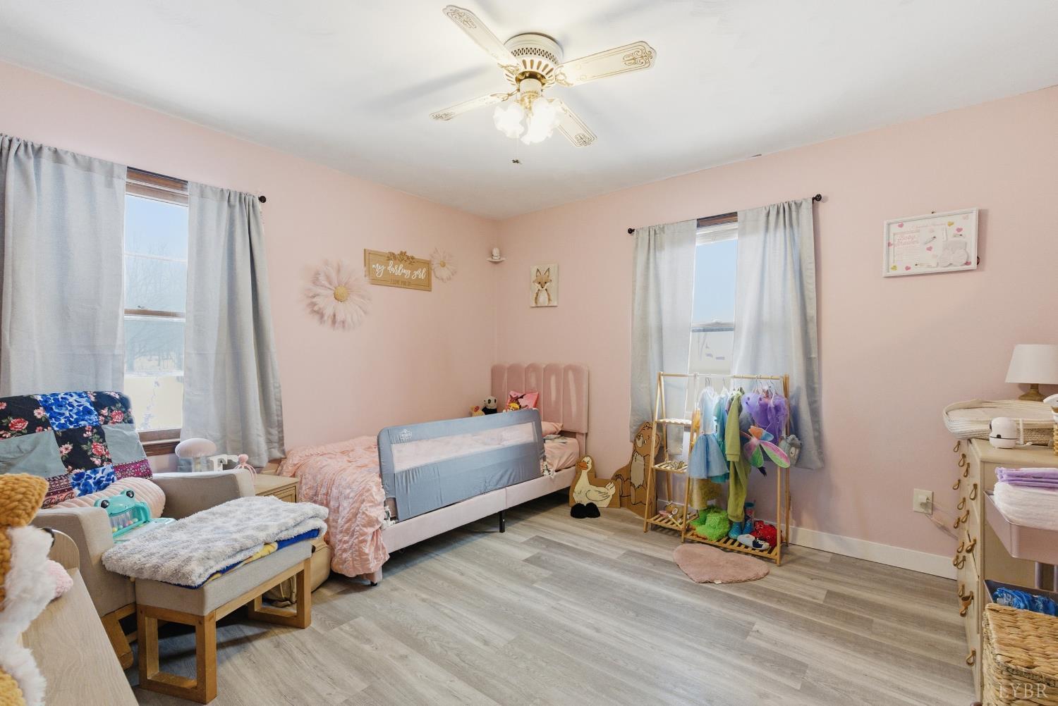 5225 Blue Ridge Drive Gretna, VA 24557 - Photo 15 of 28 a bedroom with bed and a chandelier