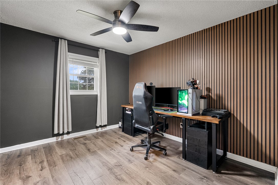 4508 Old Williamston Road Belton, SC 29627 - Photo 22 of 47 This versatile space features a modern accent wall and durable flooring, perfect for a home office or creative pursuits.