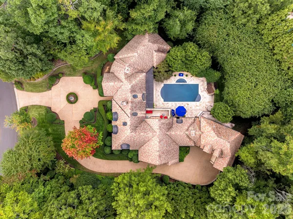 an aerial view of a house with outdoor space