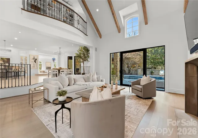 a living room with furniture fireplace and flat screen tv