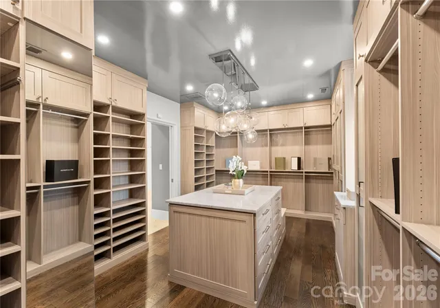 a bathroom with a shower sink vanity and mirror