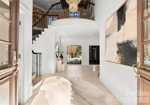 a view of a livingroom with furniture and staircase