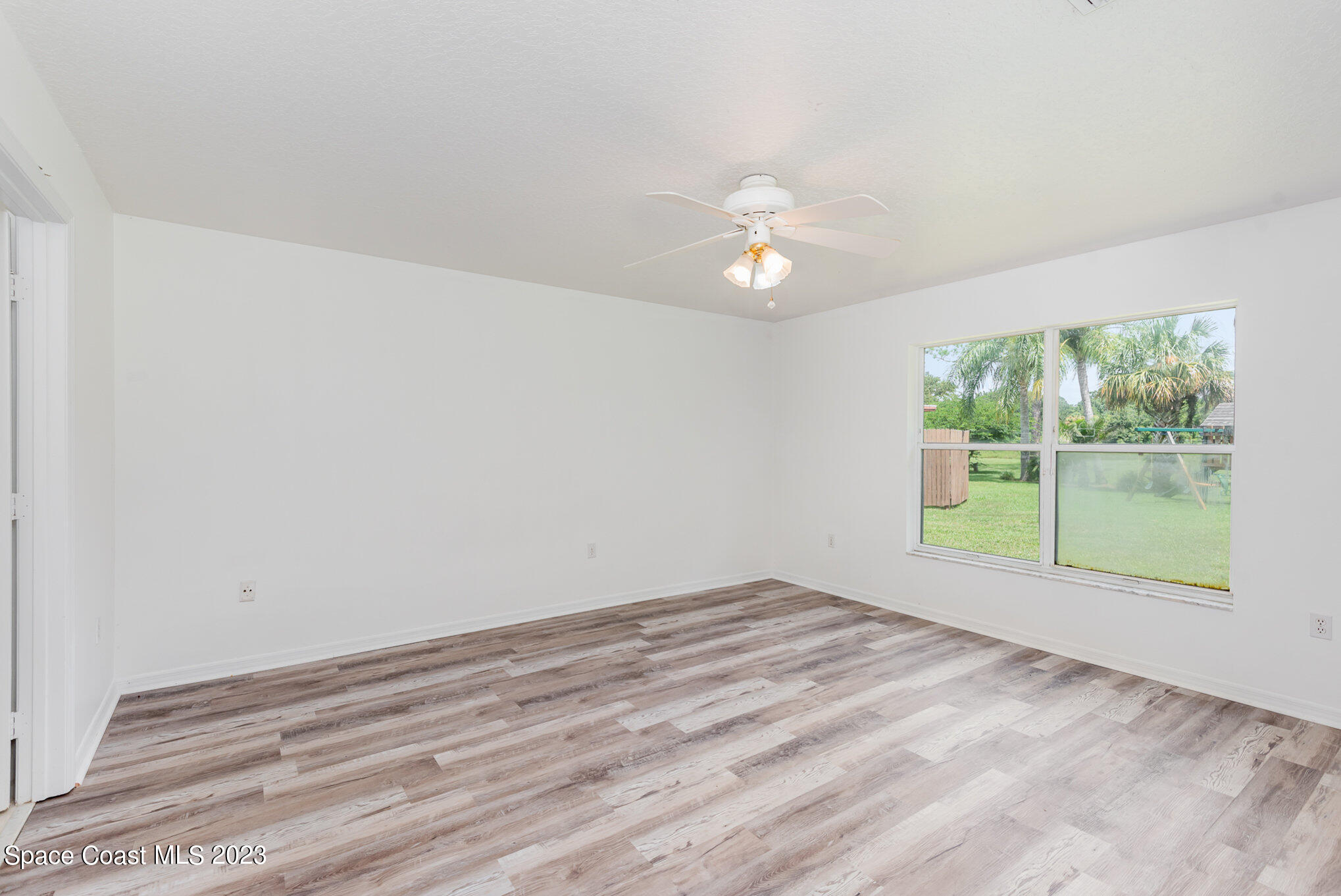 4390 London Town Road Titusville, FL 32796 - Photo 18 of 25 a view of an empty room with a window