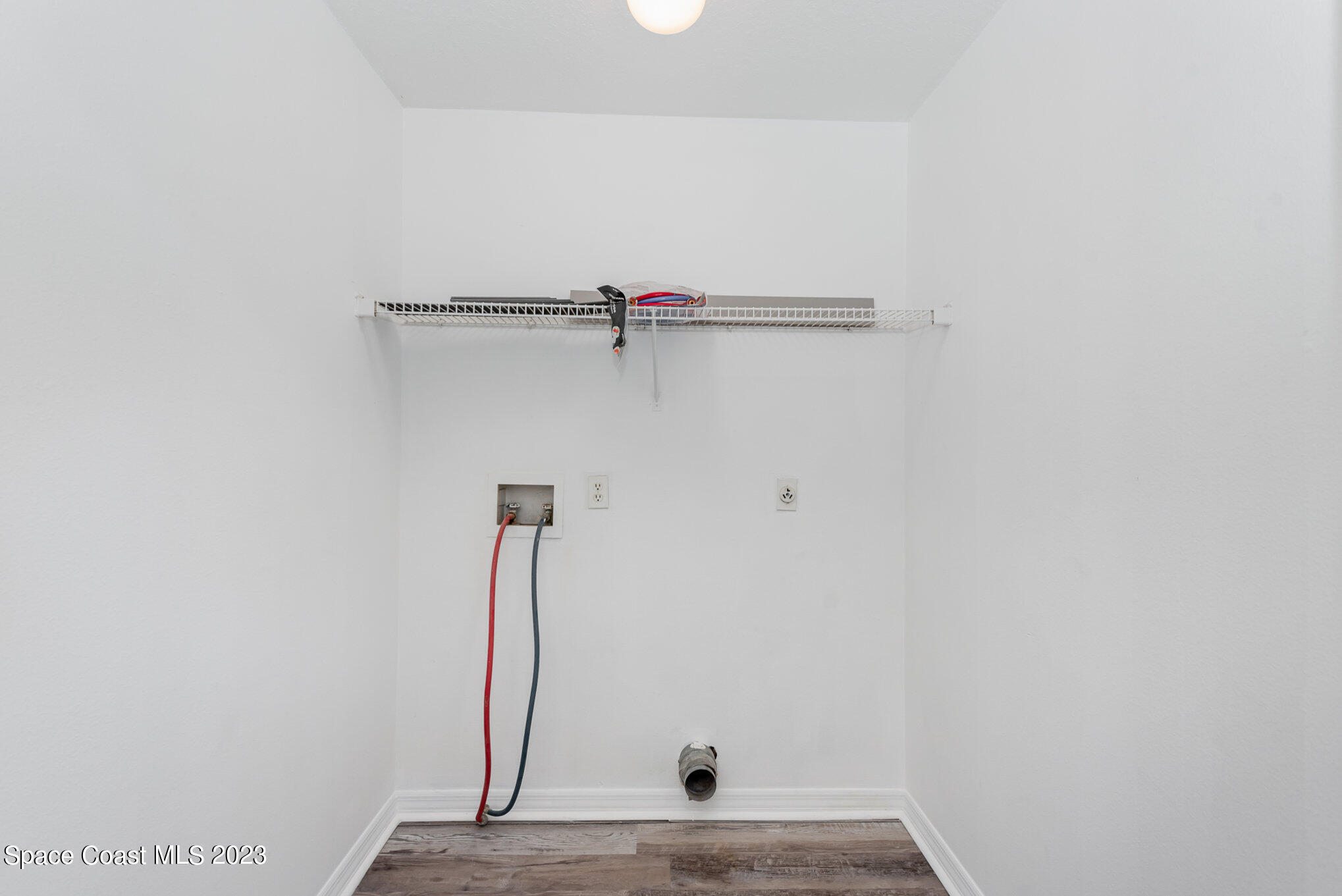 4390 London Town Road Titusville, FL 32796 - Photo 21 of 25 a view of small space with racks on the wall