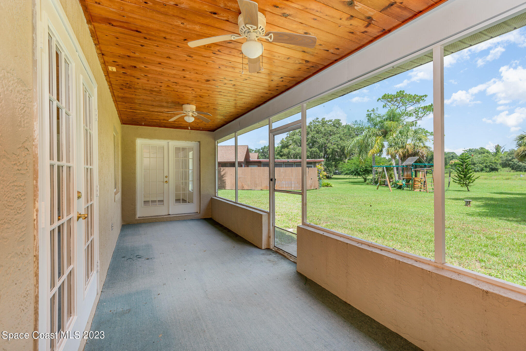 4390 London Town Road Titusville, FL 32796 - Photo 22 of 25 a view of a porch with furniture and garden