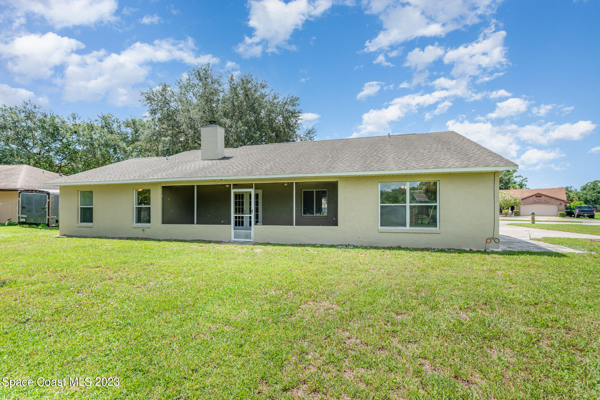 4390 London Town Road Titusville, FL 32796 - Photo 23 of 25 a front view of a house with a garden