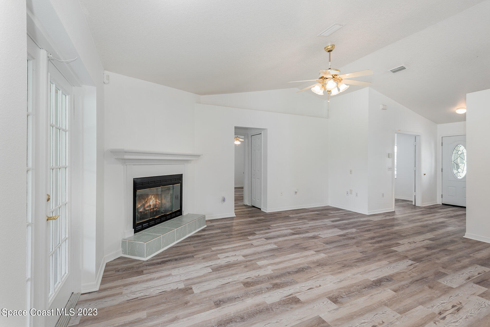 4390 London Town Road Titusville, FL 32796 - Photo 4 of 25 a view of empty room with a fireplace