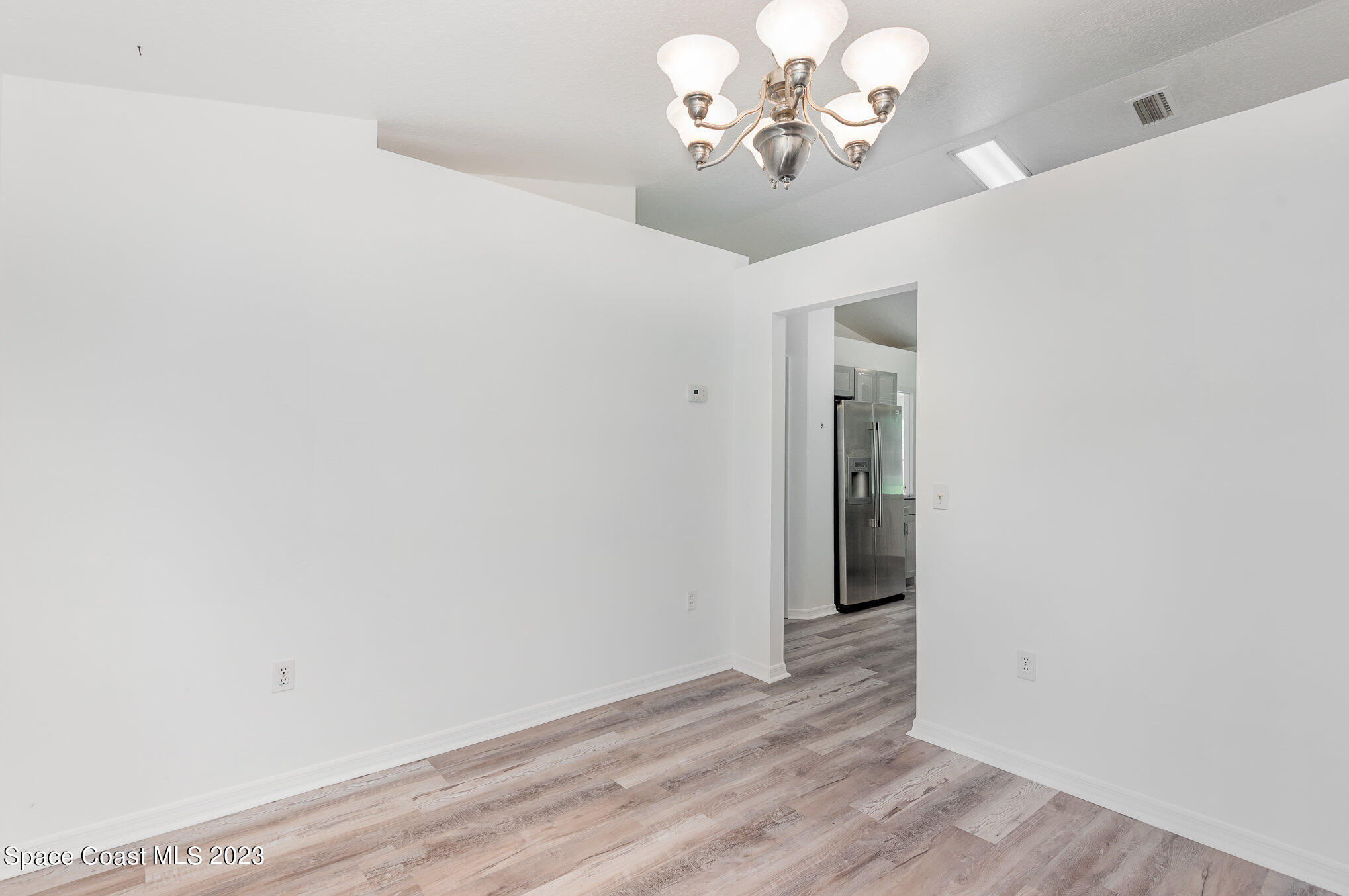 4390 London Town Road Titusville, FL 32796 - Photo 9 of 25 wooden floor in a hall with an entryway