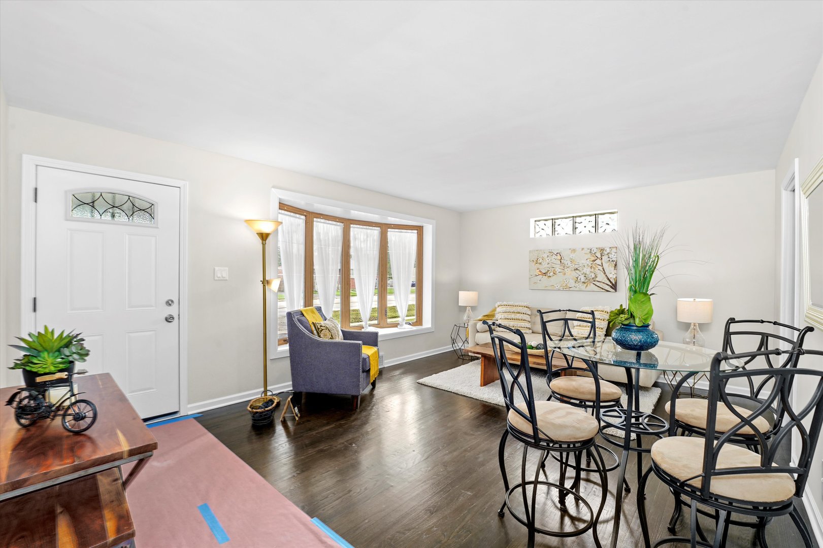 4718 Butterfield Road Hillside, IL 60162 - Photo 13 of 17 a dining room with furniture and wooden floor