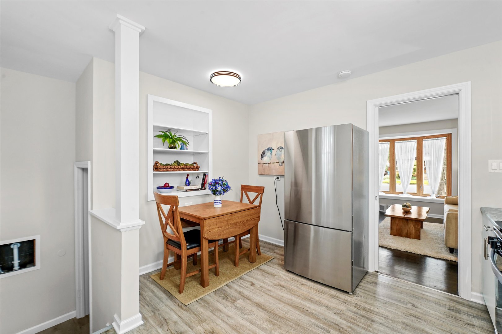 4718 Butterfield Road Hillside, IL 60162 - Photo 7 of 17 a dining room with furniture and wooden floor