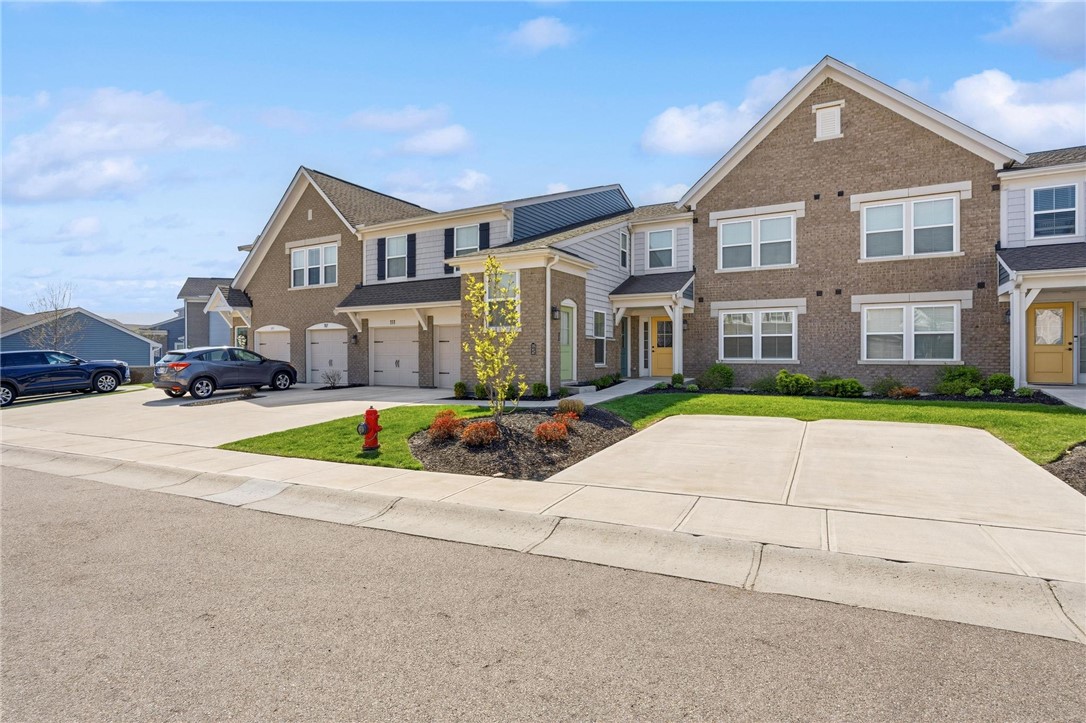 This charming residence features a classic brick exterior and offers convenient unattached garage parking, ideal for your vehicle or additional storage.