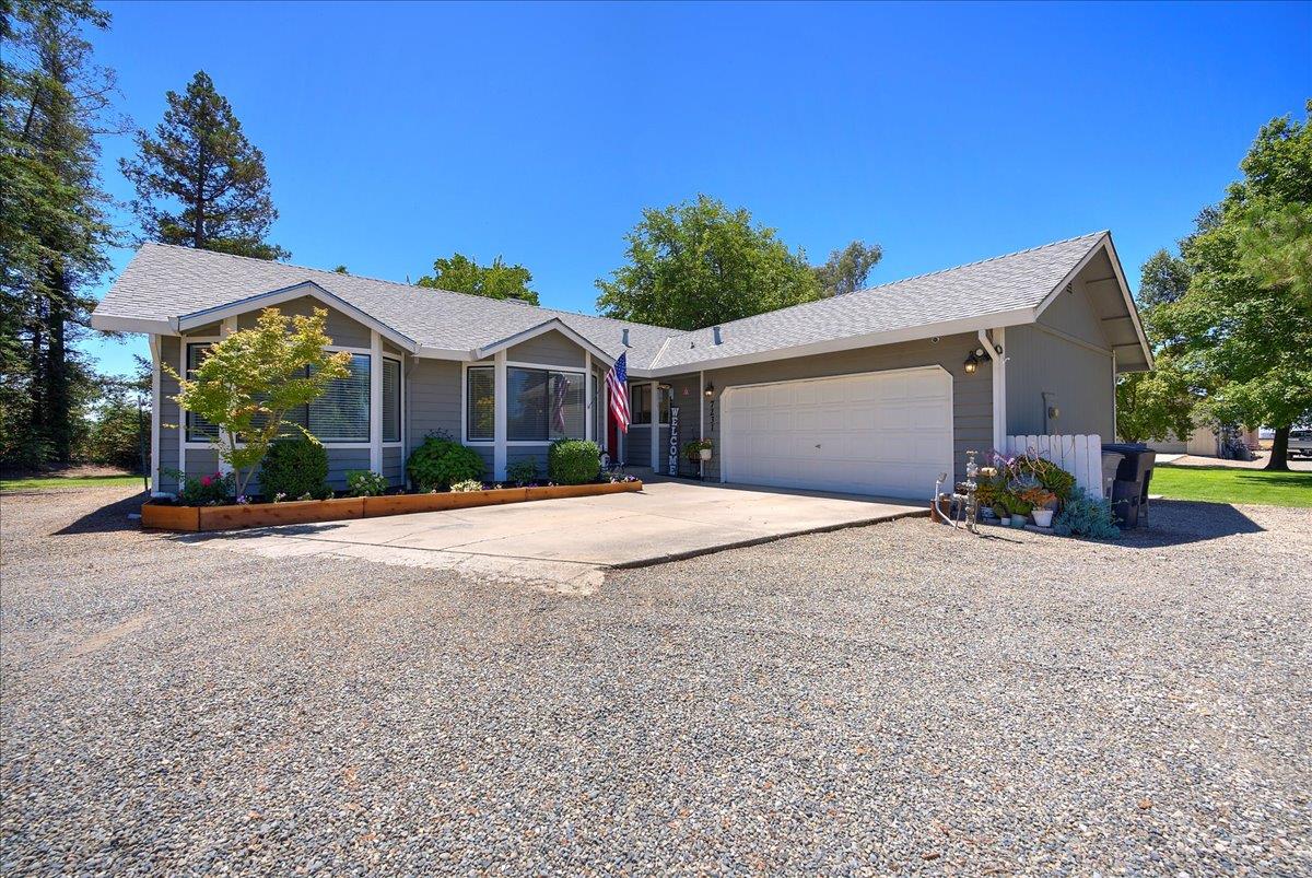7231 Pleasant Grove Road Pleasant Grove, CA 95668 - Photo 1 of 1 a front view of a house with a yard and garage