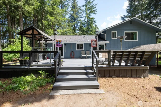 a view of a house with wooden fence