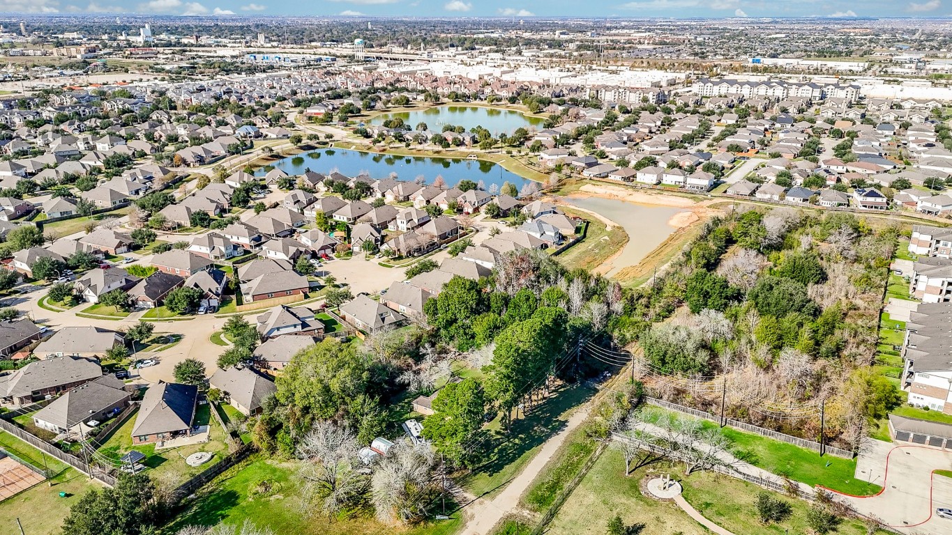 1021-1033 Roesner Road Katy, TX 77494 - Photo 14 of 29 an aerial view of residential houses with outdoor space