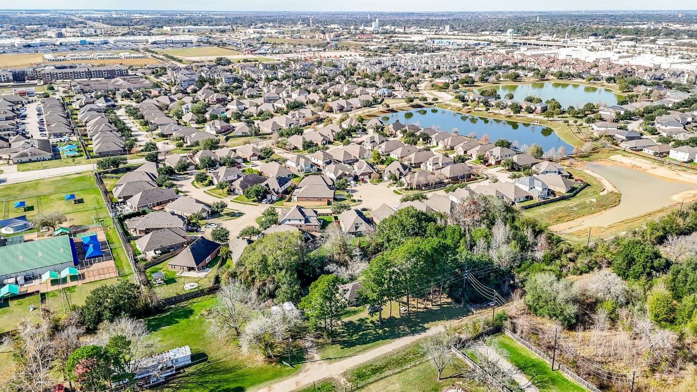 1021-1033 Roesner Road Katy, TX 77494 - Photo 15 of 29 an aerial view of residential houses with outdoor space and trees