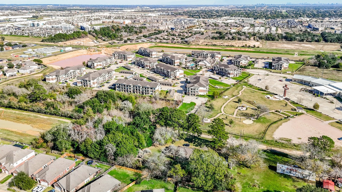 1021-1033 Roesner Road Katy, TX 77494 - Photo 19 of 29 an aerial view of residential building and lake view